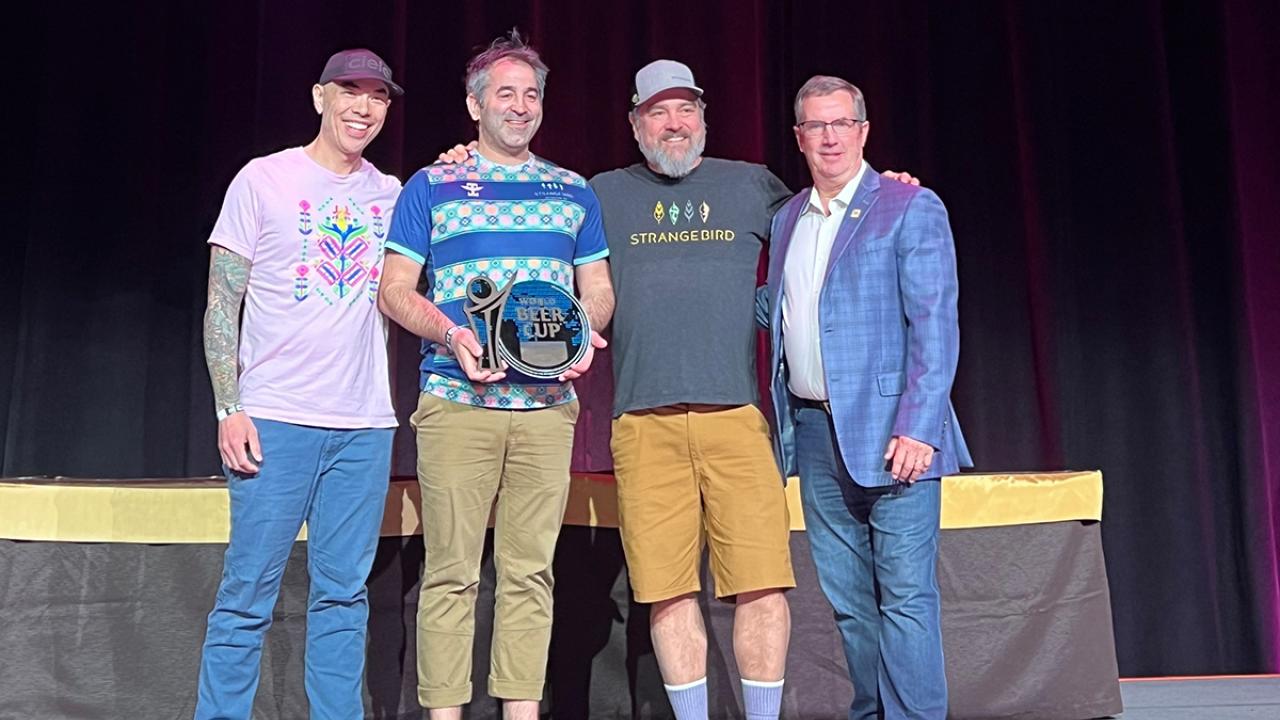 UC Davis Master Brewers grad receives a bronze medal with his colleagues during the 2024 World Beer Cup