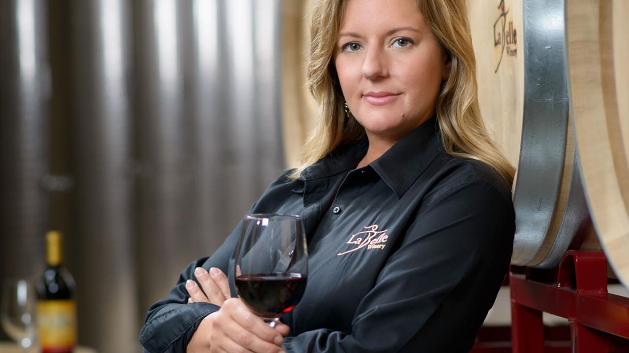 UC Davis Winemaking Certificate graduate Amy LaBelle poses in her winery