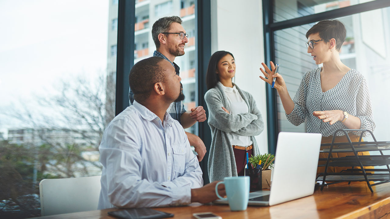 woman talking to colleagues