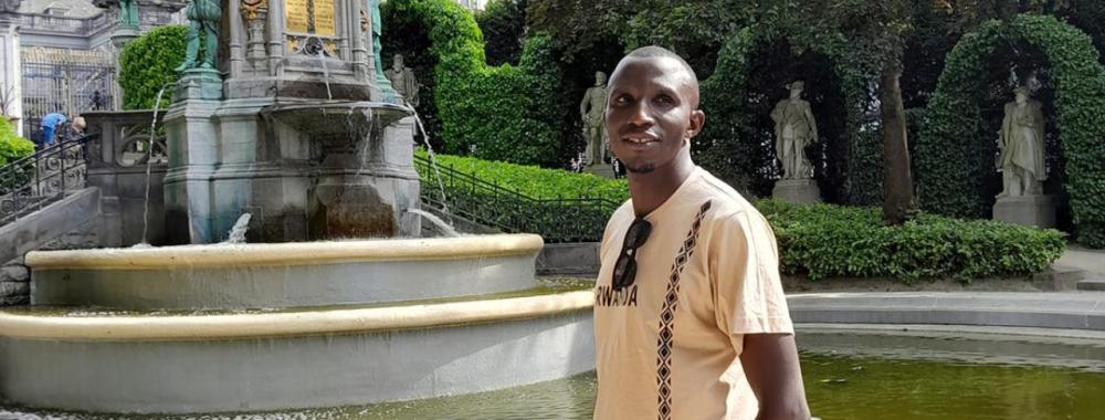 A student near a fountain.