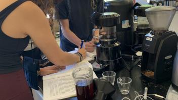 UC Davis Pre-College students record their coffee making process in their lab journals