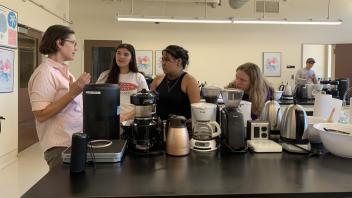 UC Davis Professor Kuhl interacts with UC Davis pre-college program students in the Coffee Lab