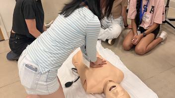 Students practice CPR after learning the basics during the UC Davis Pre-College Program