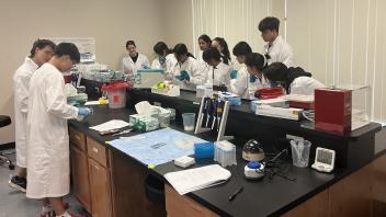 UC Davis pre-college students pipetting the Forensics DNA lab