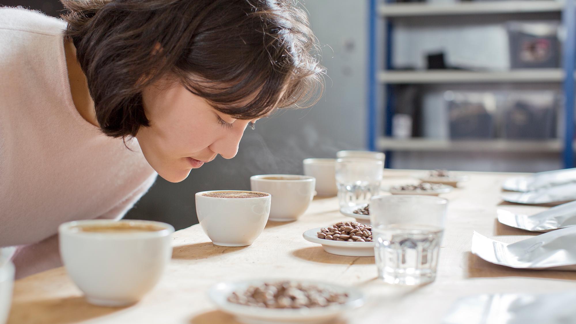 woman smelling coffee in a sensory lab