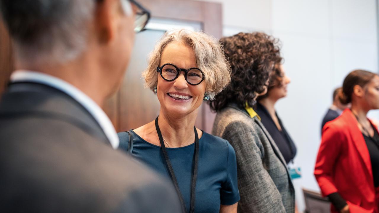 people chatting at an event