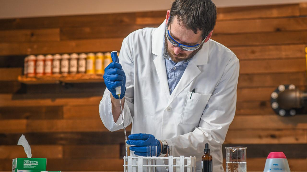 UC Davis Master Brewers grad Alan Windhausen in a beer lab