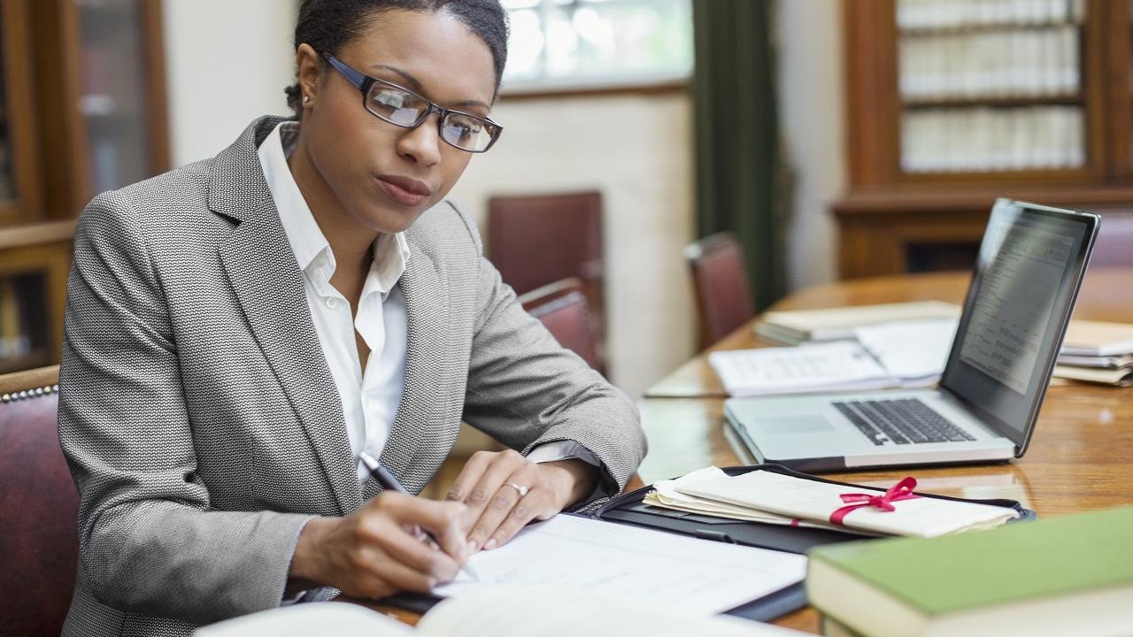 Paralegal doing work at a desk