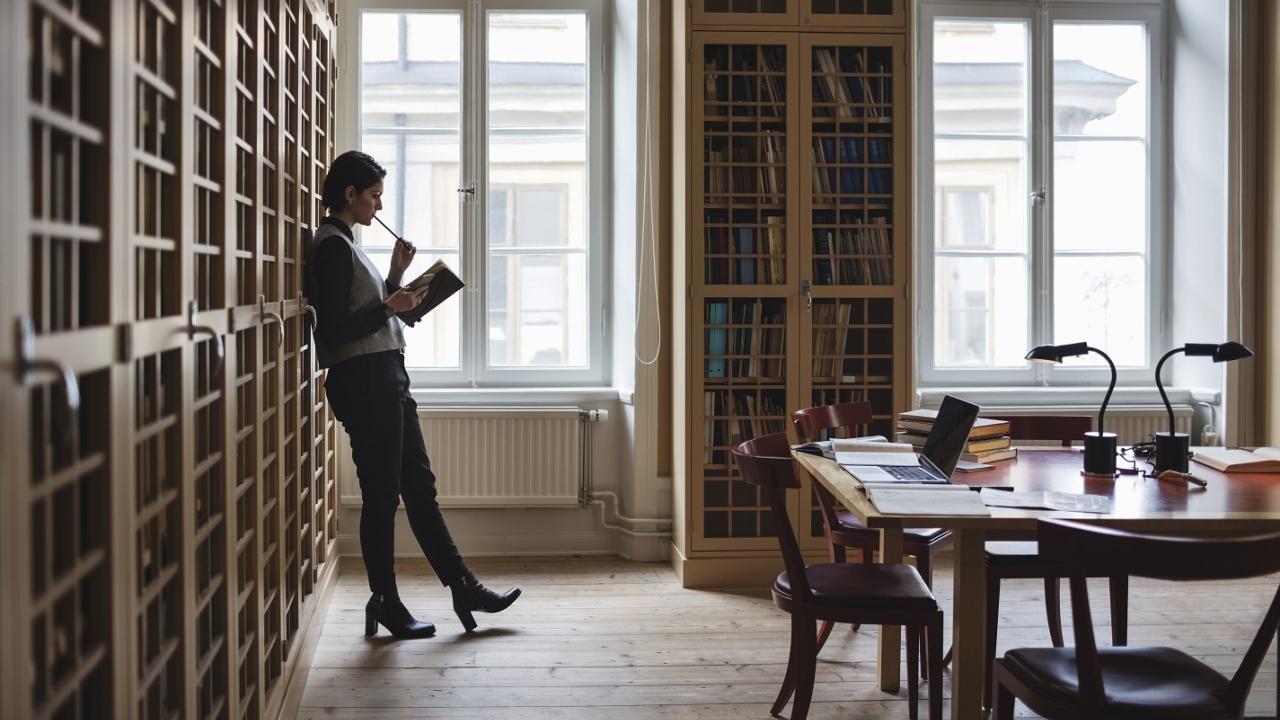 Person Standing in Library