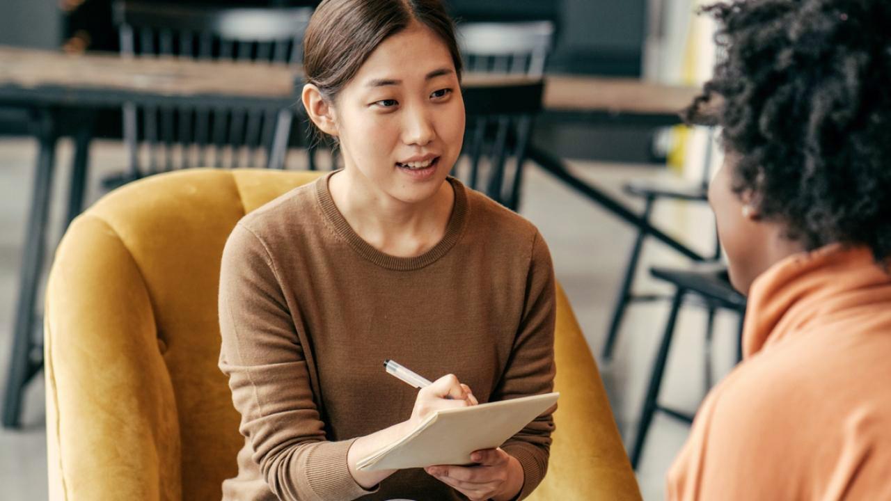 Picture of a student working with a client