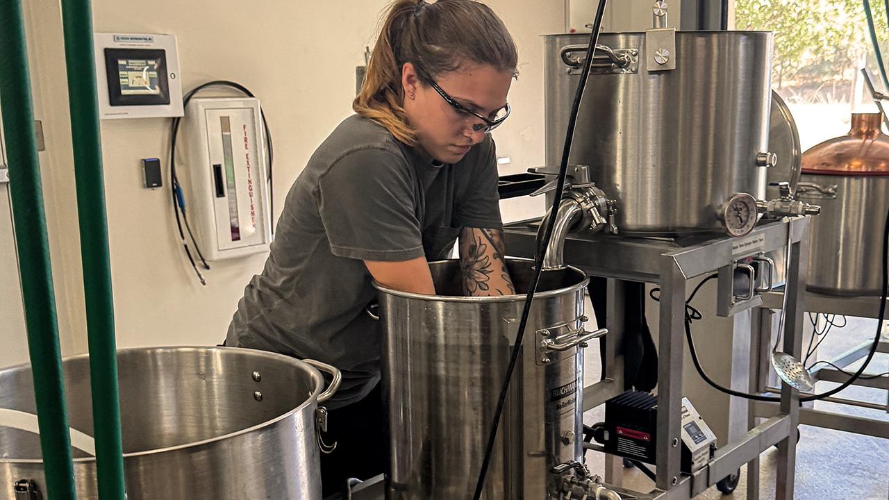 UC Davis Master Brewers Program grad Samantha Simpson gets hands-on experience in the lab during the bootcamp