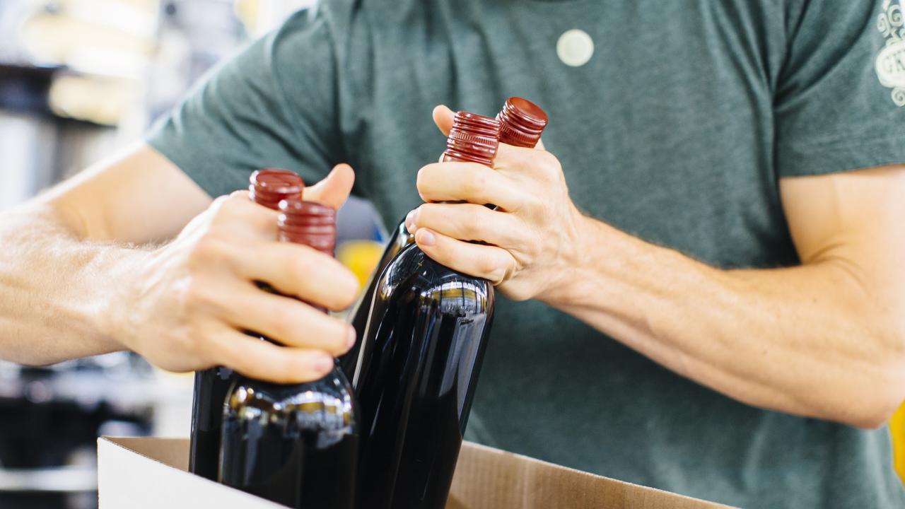 Winemaking Student Packing bottles of wine