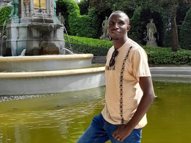 A student near a fountain.