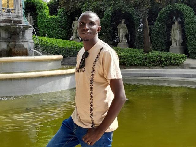 A student near a fountain.