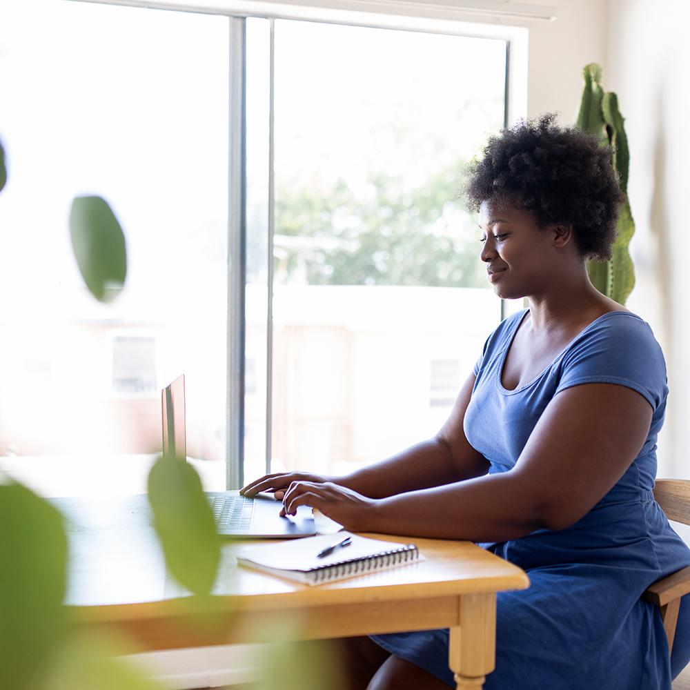 woman typing on laptop computer