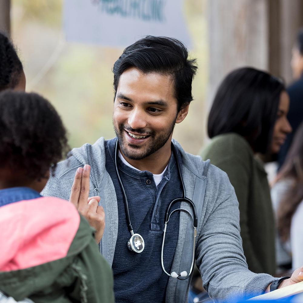 medical professional examining a child