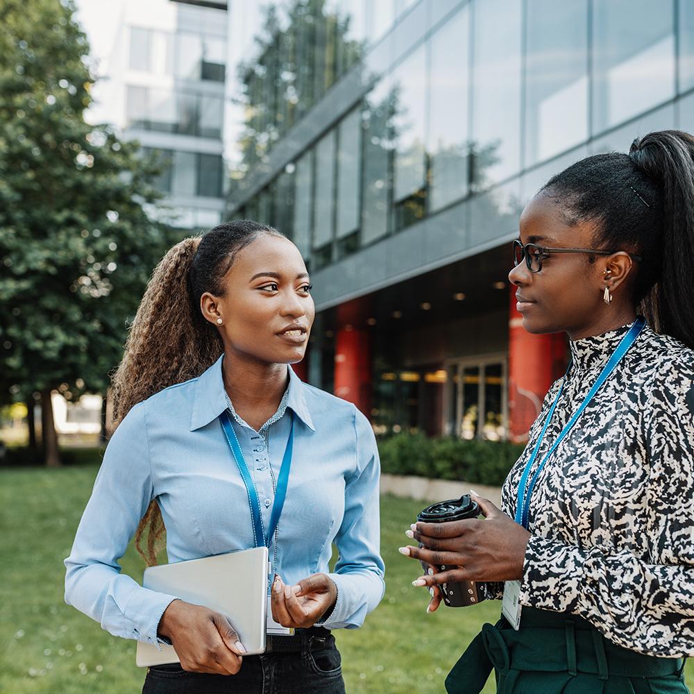 colleagues talking in an office courtyard