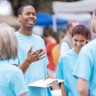 A volunteer leader gives instructions to fellow volunteers