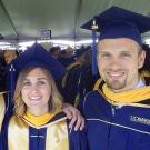 UC Davis Forensic Science graduate Shane Williams and fellow alumni in cap and gown at graduation