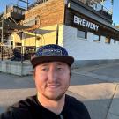 UC Davis Master Brewers graduate Shae Vaughn poses outside Storm Peak Brewing Co
