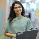 UC Davis Sensory Science and Consumer Testing Certificate Program grad Taruna Sanghi poses in office with laptop
