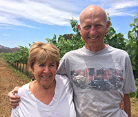 Winemaking Certificate grad Rich McClellan and wife in vineyard