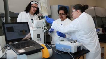 Cell and Gene therapy students working in lab