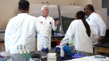 Students in the UC Davis Cell and Gene Therapy Manufacturing Bootcamp in the lab