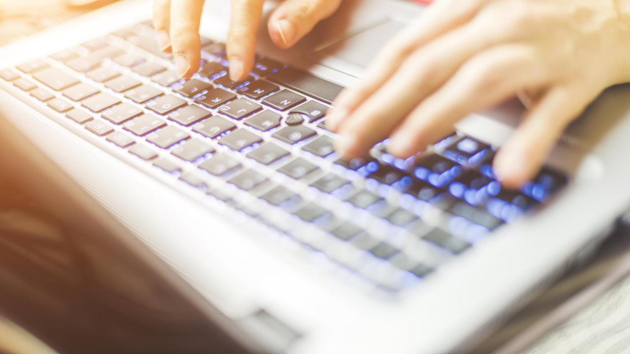 woman working at a laptop computer