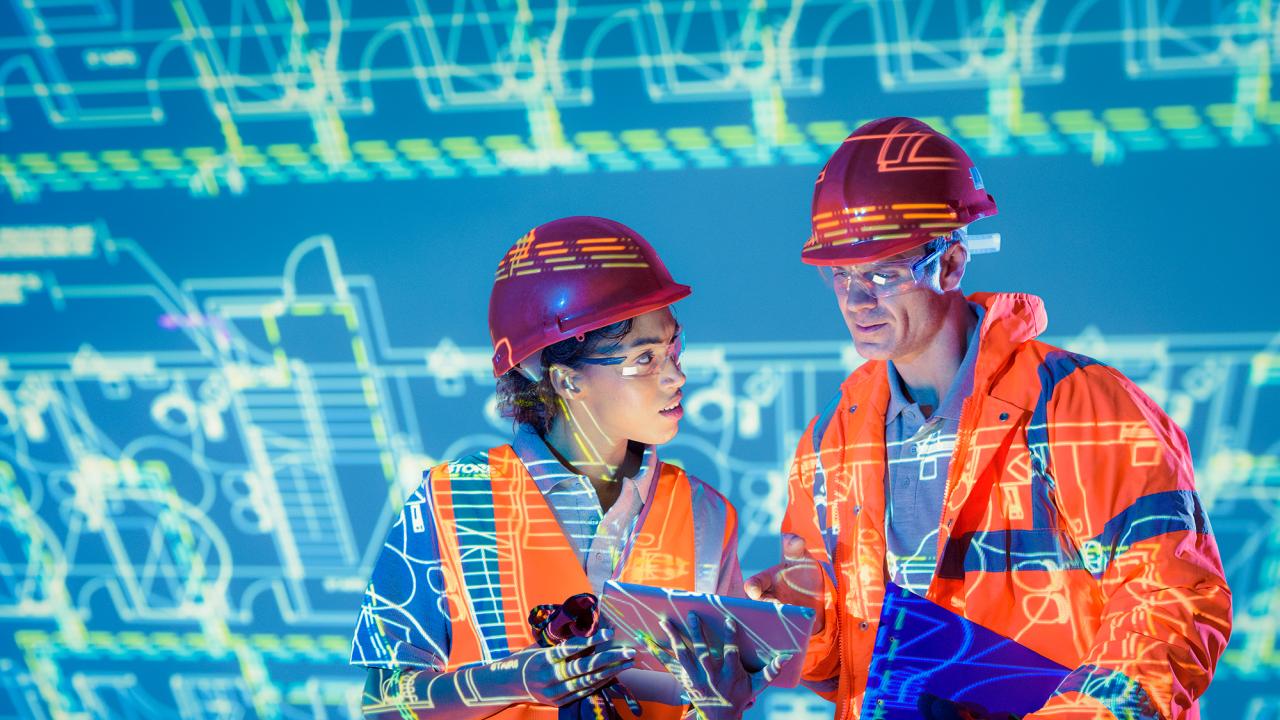 construction workers looking at plans