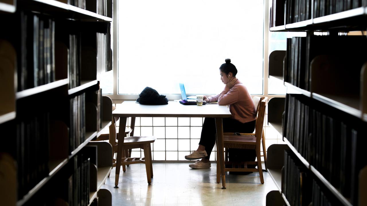 student studying at UC Davis library