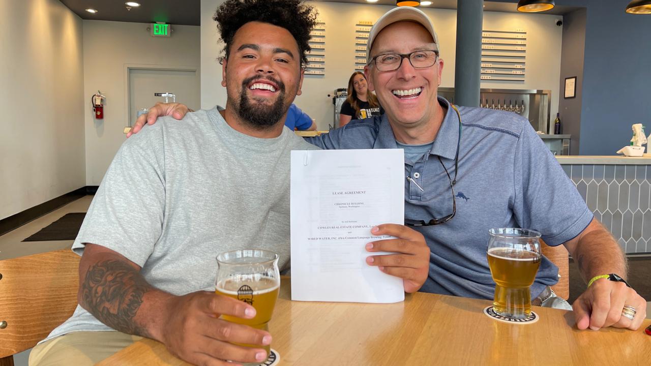 Master brewer grad Sean Owens with partner and brewery lease agreement