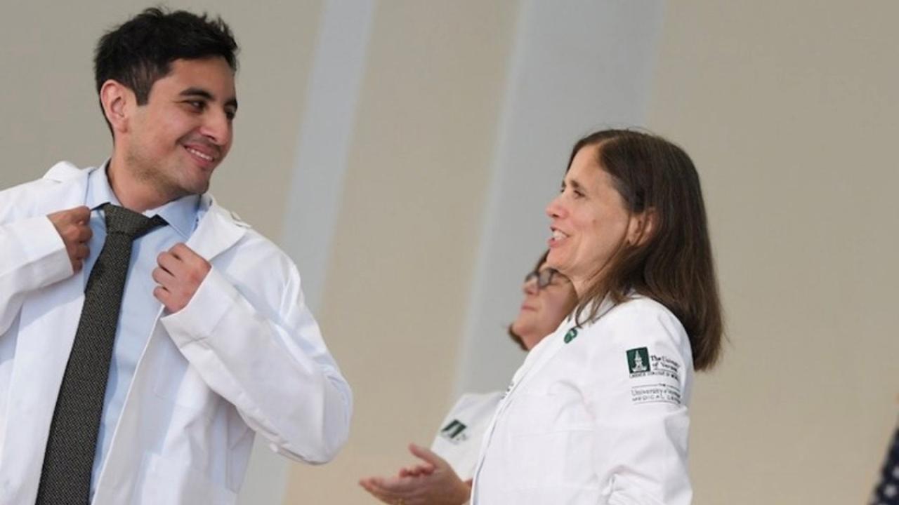 UC Davis Health Professions post-bac grad Francisco Cordero receives his white coat