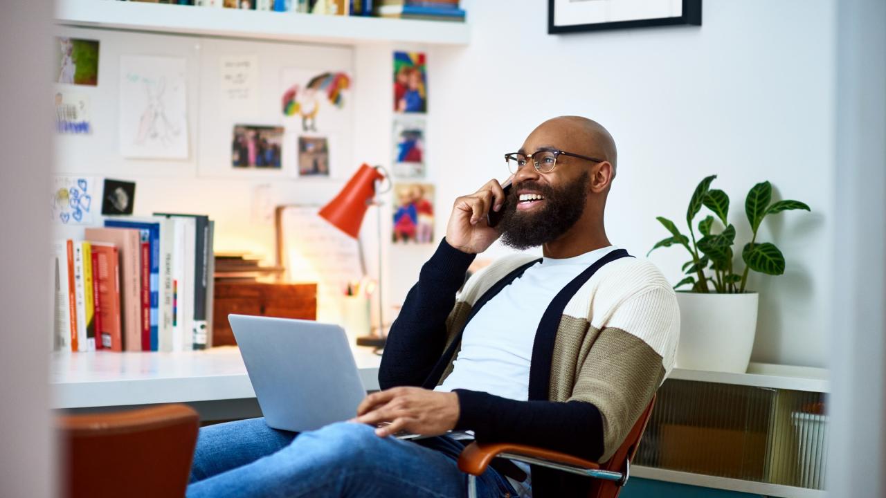Guy talking on the phone while sitting