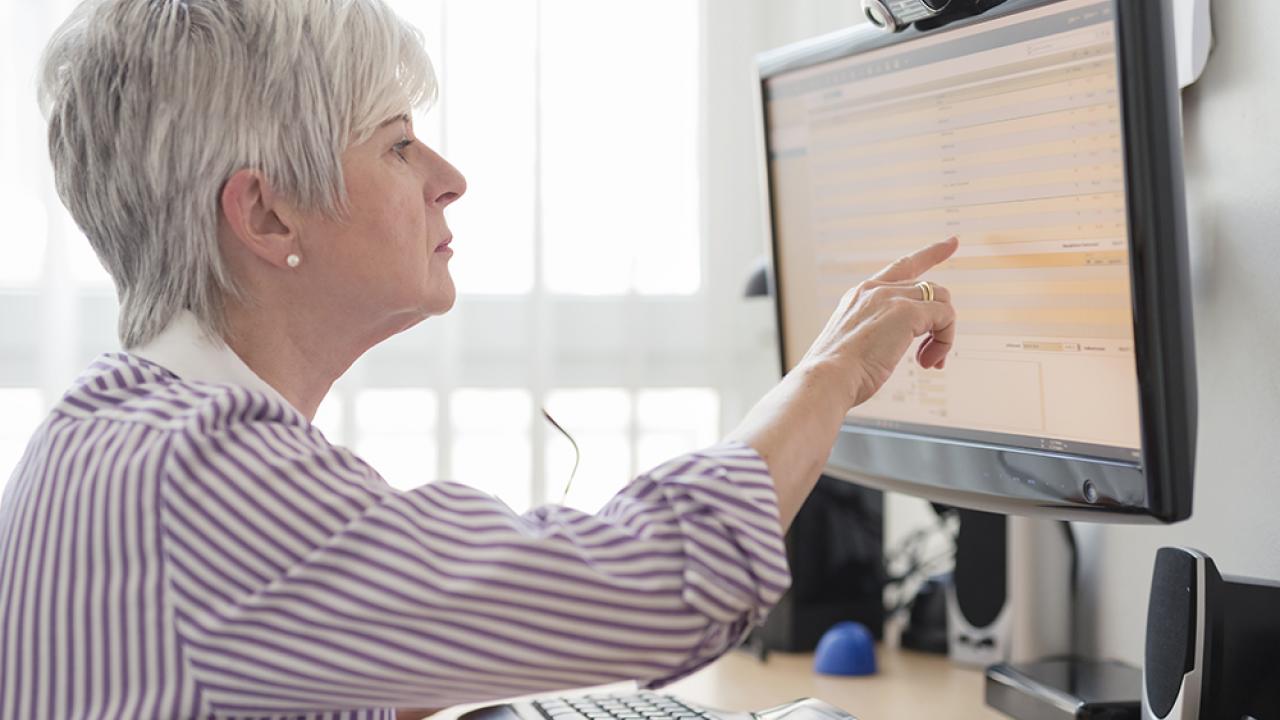 senior women pointing to computer screen