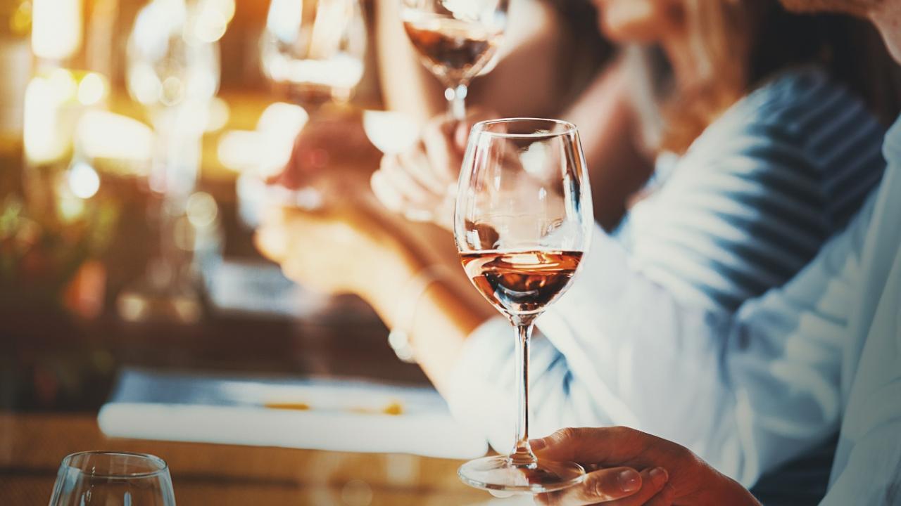 Person holding a wine glass