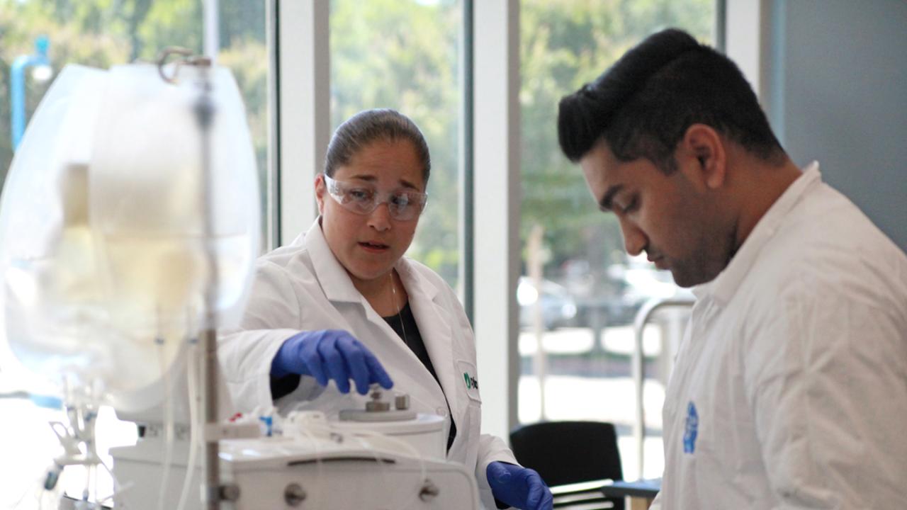 students in cell and gene therapy lab with instruments