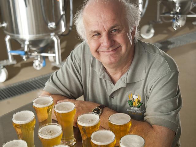 online beer quality instructor Charlie Bamforth in front of beer glasses