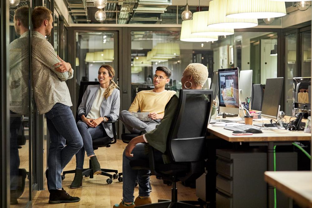 young colleagues chatting in office