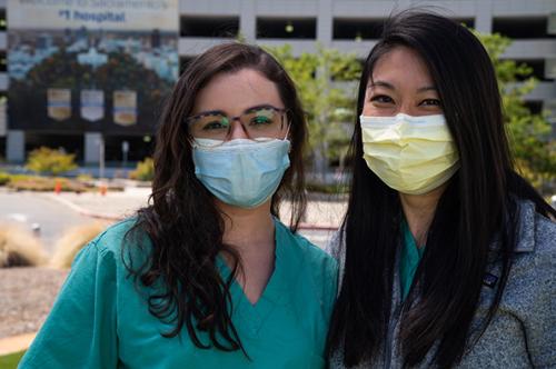 young women wearing surgical masks