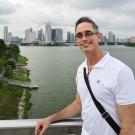 UC Davis Sensory Science Certificate grad Amaury Borges Miranda poses on a bridge in Singapore
