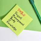 Project Management Body of Knowledge text on sticky note