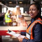 femal OHS worker with clipboard