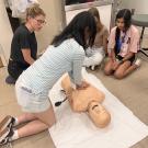 Students practice CPR after learning the basics during the UC Davis Pre-College Program
