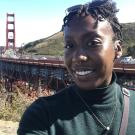 Kristen Fawole, chemical engineering of coffee instructor, poses near Golden Gate bridge
