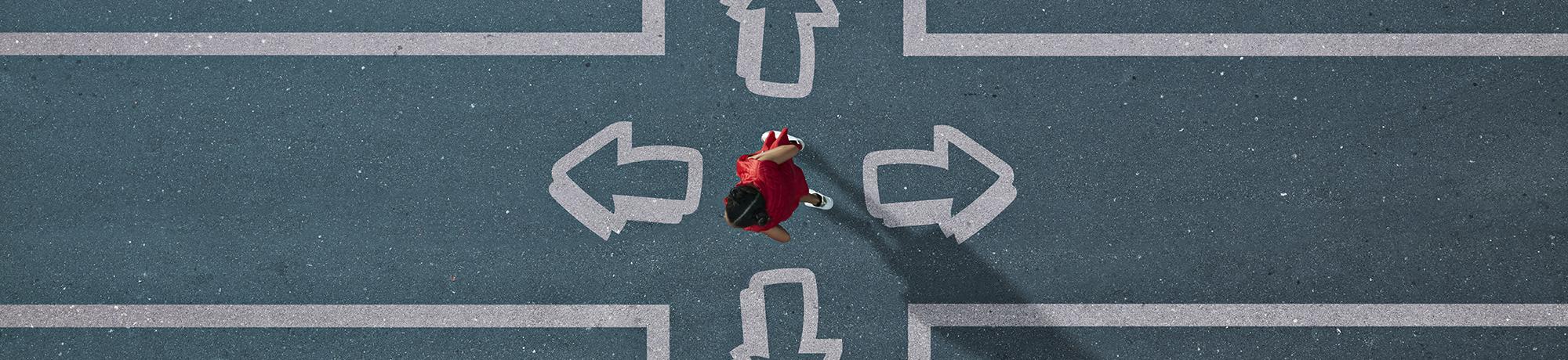 woman choosing direction in painted crossroad